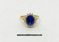 www.hersandhistreasures.com/products/lab-created-oval-blue-sapphire-halo-10k-yellow-gold-ring