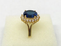 www.hersandhistreasures.com/products/lab-created-oval-blue-sapphire-halo-10k-yellow-gold-ring