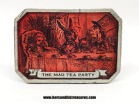 www.hersandhistreasures.com/products/1974-alice-in-wonderland-the-mad-tea-party-bergamot-brass-works-belt-buckle-usa