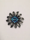www.hersandhistreasures.com/products/Flower-Brooch-With-Blue-Rhinestone-Center