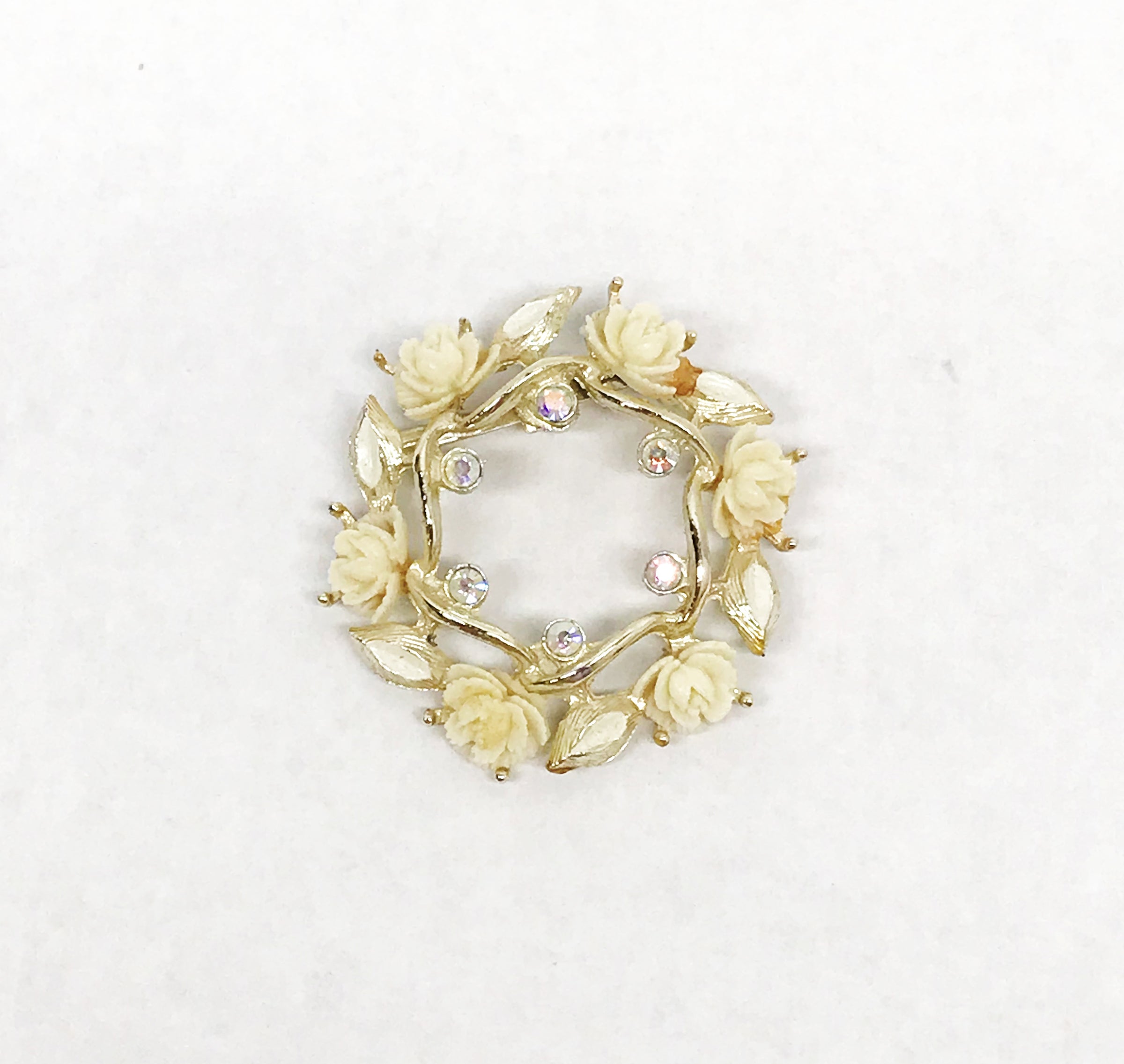 www.hersandhistreasures.com/products/celluloid-roses-and-ab-rhinestone-gold-tone-circle-brooch-pin