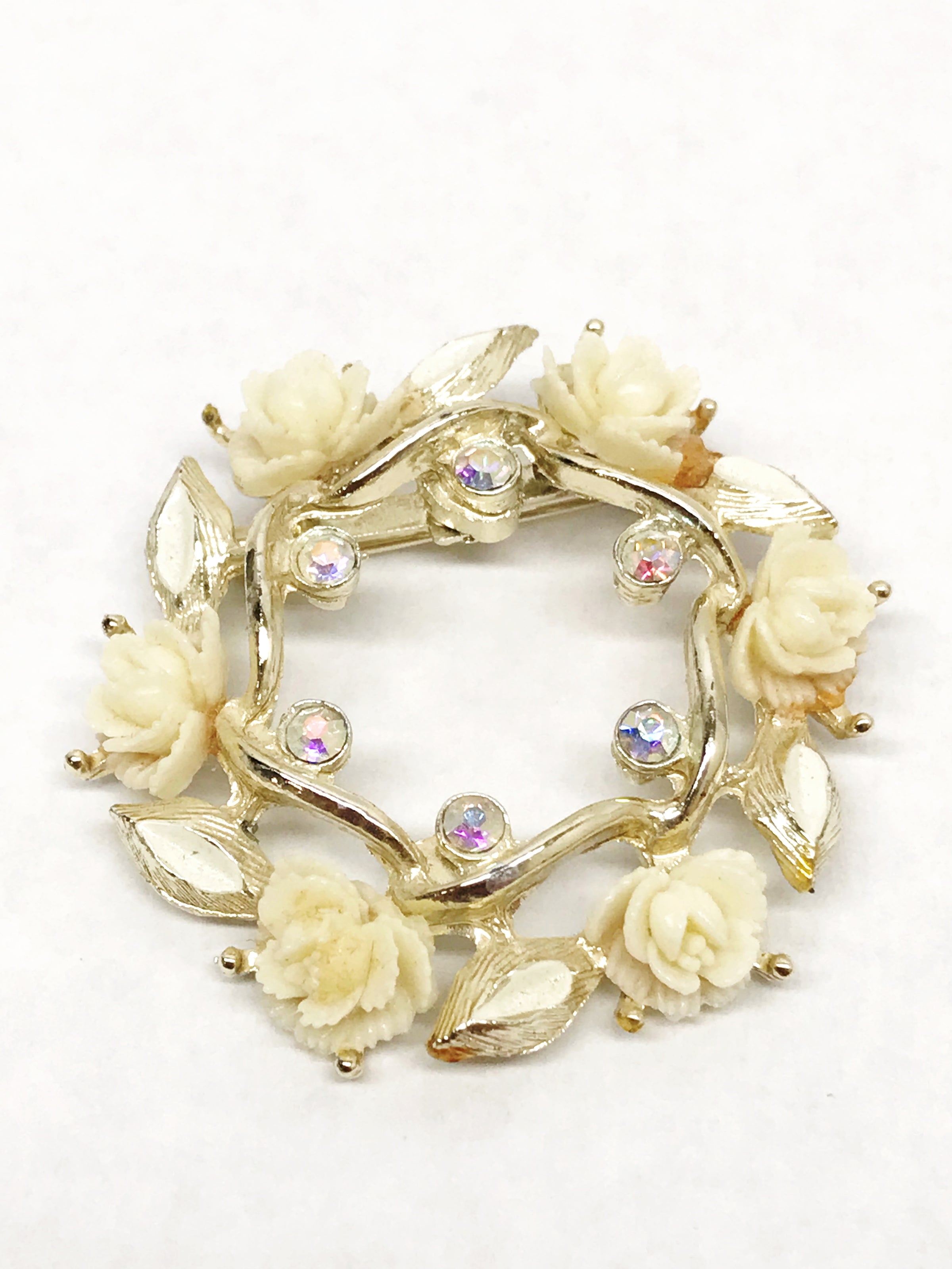 www.hersandhistreasures.com/products/celluloid-roses-and-ab-rhinestone-gold-tone-circle-brooch-pin
