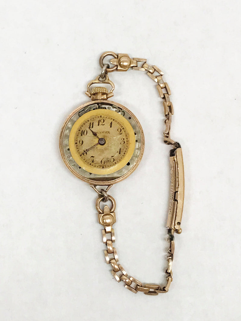 www.hersandhistreasures.com/products/1930s-hallmark-20-year-gold-filled-over-sterling-silver-ladies-wristwatch